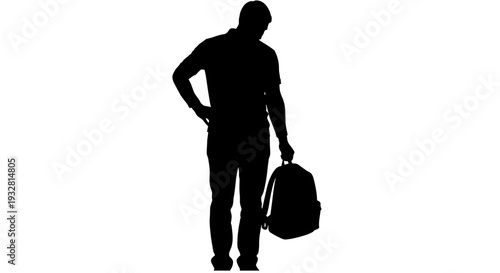 Man standing with luggage in hand.