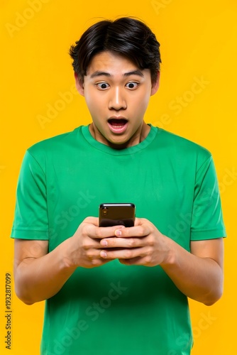 Surprised Man Looking at Phone with Shocked Expression