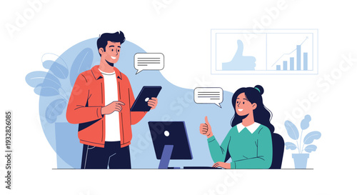 Two young professionals working together at a modern office desk using a computer and tablet while exchanging positive feedback ideas.