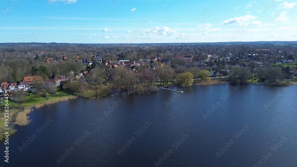 Fototapeta premium Village houses along lake shore in Schleswig Holstein Germany