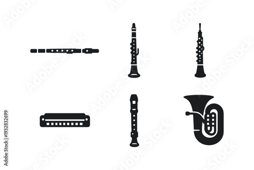 Collection of wind and reed musical instruments in silhouette, isolated on white background