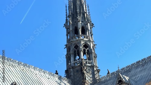 A close-up of the newly completed spire of Notre-Dame de Paris cathedral