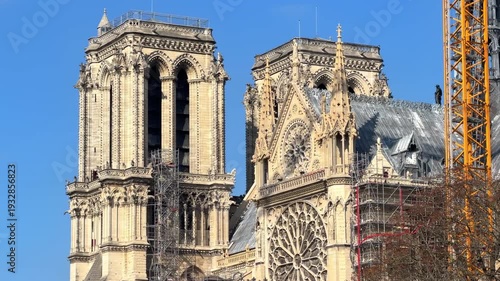 Side view of the south transept and towers of Notre Dame de Paris cathedral facade in France