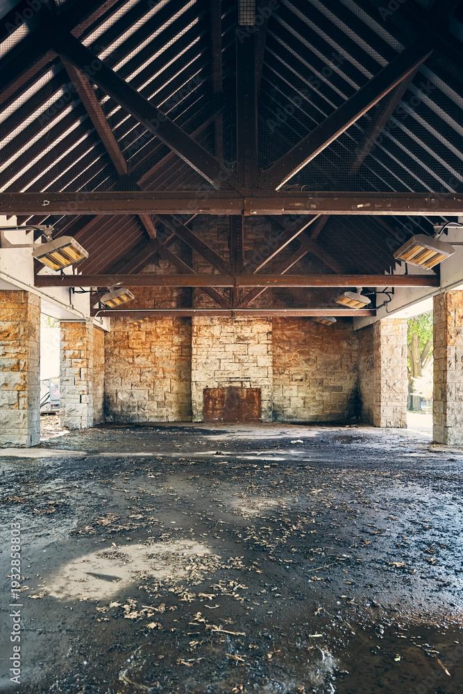 Fototapeta premium Rustic stone and timber park shelter interior