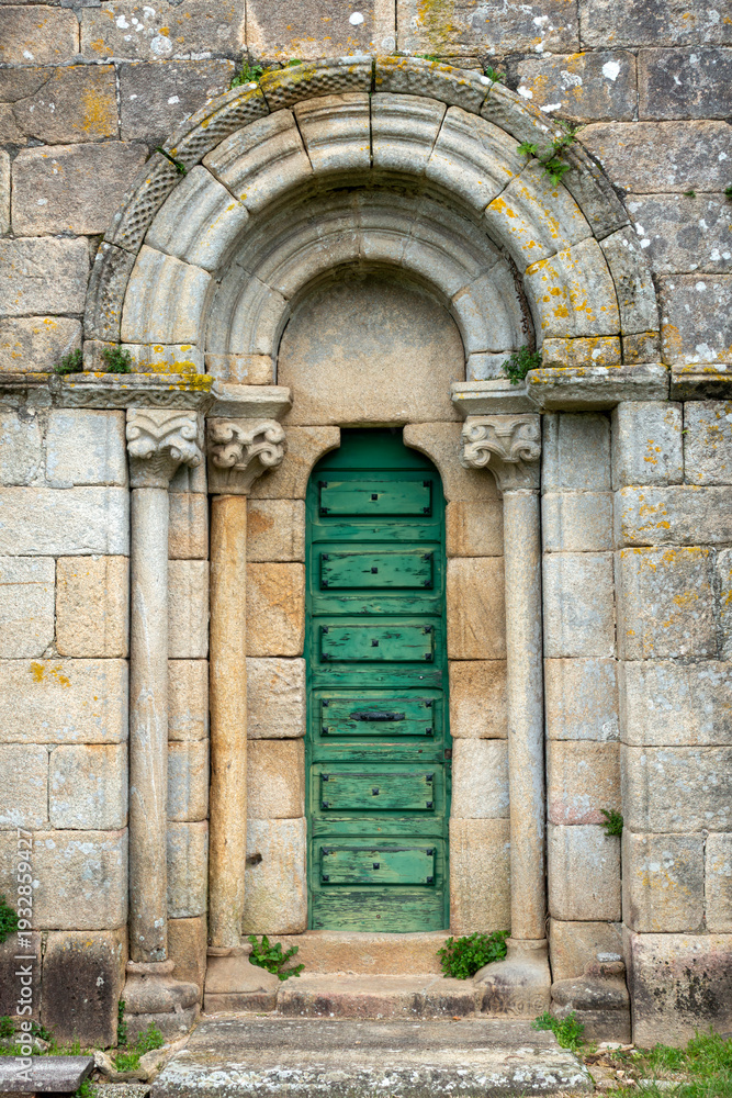 Fototapeta premium Exquisite 12th-century Romanesque south portal of Santa Maria de Herbon church with decorated archivolts and granite columns, Padron, Galicia, Spain