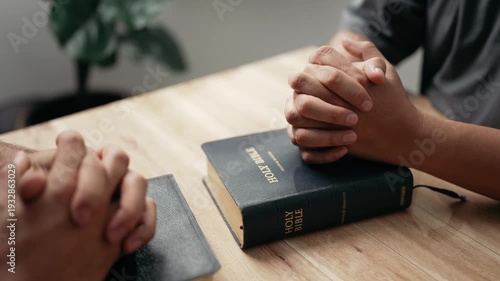 Wallpaper Mural Christian worship and pray. Christian group of people holding hands praying worships together to believe and Bible on wooden table for devotional for prayer meeting concept. Torontodigital.ca