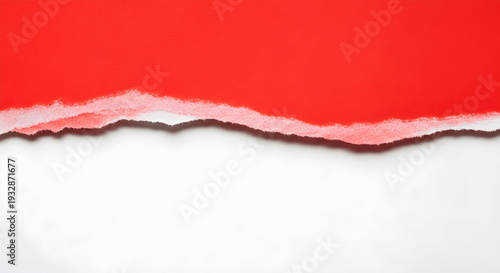 Torn red paper revealing white background with ripped edge and textured effect for design use