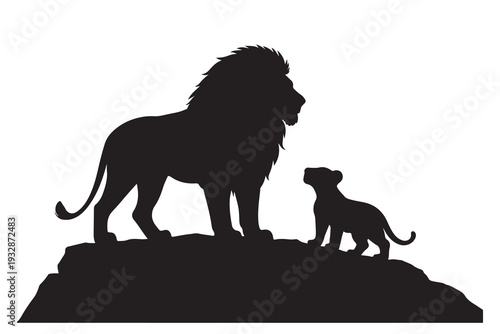 Silhouette of a majestic male lion and his young cub standing on a rocky outcrop.