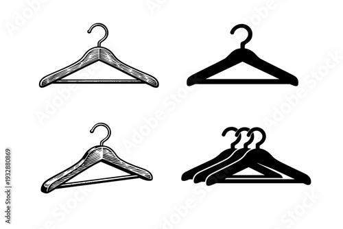 Set of four vintage and modern clothes hangers on white background