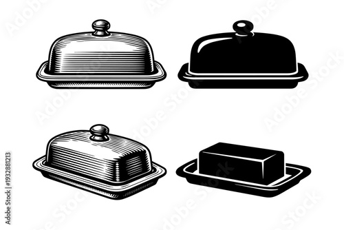 Monochrome butter dishes and rectangular butter block on trays