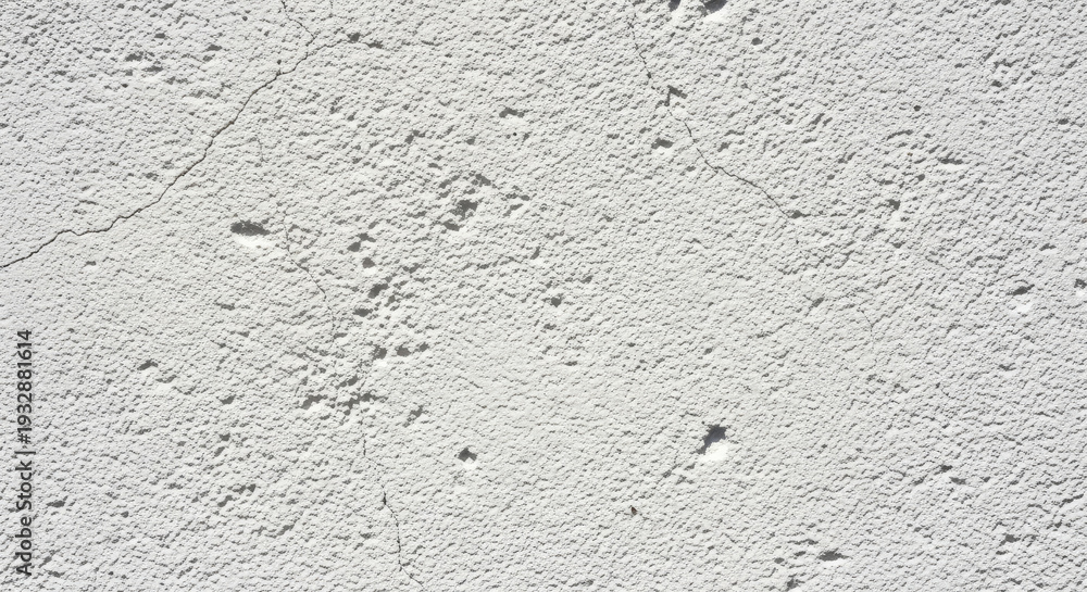Obraz premium Gray textured surface with yellow stain.