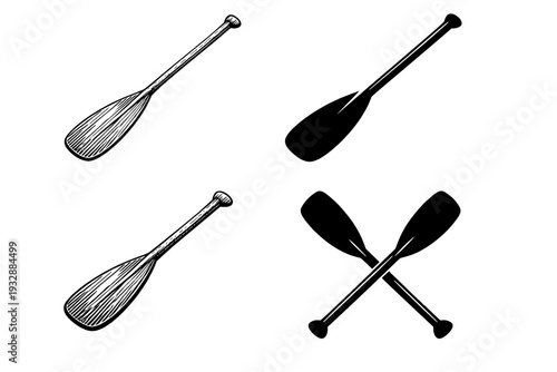 Four black and white canoe paddles in various configurations