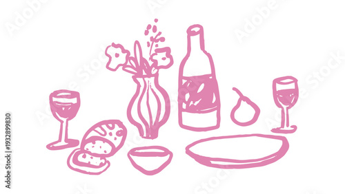 Romantic dinner setup with wine and flowers on table