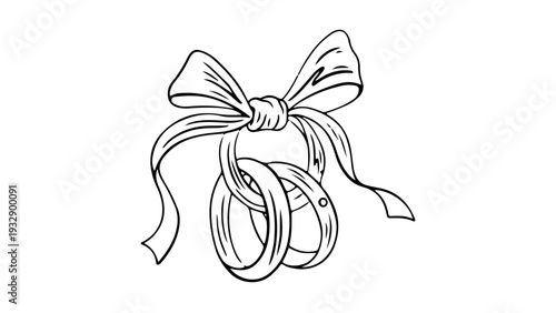 Elegant wedding rings tied with romantic bow