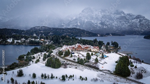 Aerial winter view of Llao Llao Hotel surrounded by snow and mountains in Bariloche, Patagonia, Argentina.