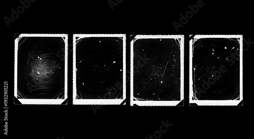 Collection of four distressed white photo frames on black background with scratches and damage effect
