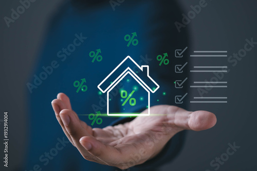 Home loan, mortgage interest rate concept with house icon and percentage symbols above hand. Ideal for real estate finance, housing loans, refinancing, property investment, financial planning visuals.