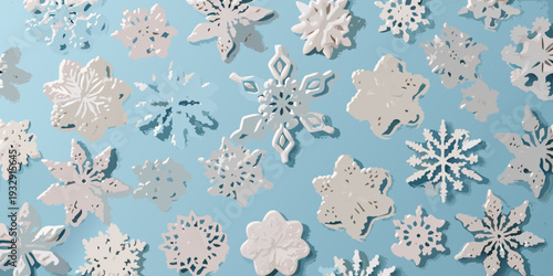 A collection of paper snowflakes against a light blue background