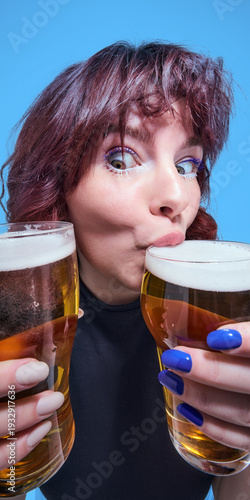 Cuadro en lienzo Woman tasting foam from two glasses of light beer close up portrait