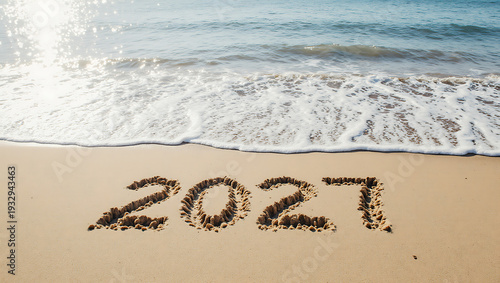 The number 2027 is written on the seashore, symbolizing the new year 2027. The waves wash over the shore where the number is written.