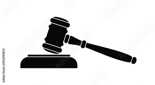 A stark black silhouette depicts a traditional gavel resting on a sound block symbolizing justice and legal proceedings silhouette