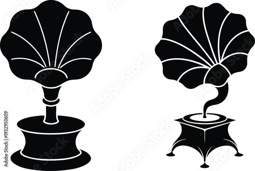 Two black vintage gramophones with intricate details on white background music 1
