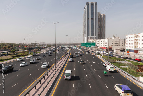 Canvas Print Traffic flow on a major highway in Dubai, and the road network efficiency to vital commercial, industrial, and residential developments