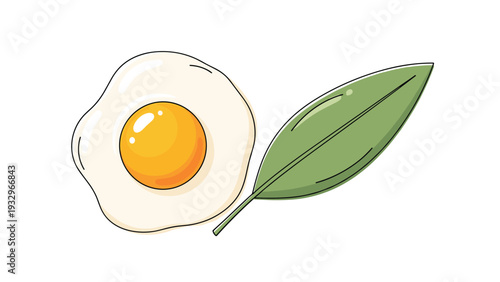 Perfectly cooked sunny side up fried egg with a vibrant yellow yolk, presented next to a fresh green leaf.