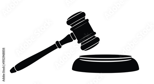 A stark black silhouette of a traditional wooden gavel resting upon a sound block symbolizing law and order silhouette