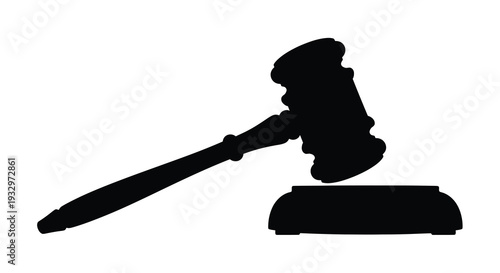 A stark black silhouette of a traditional gavel resting on a sound block symbolizing law and order silhouette