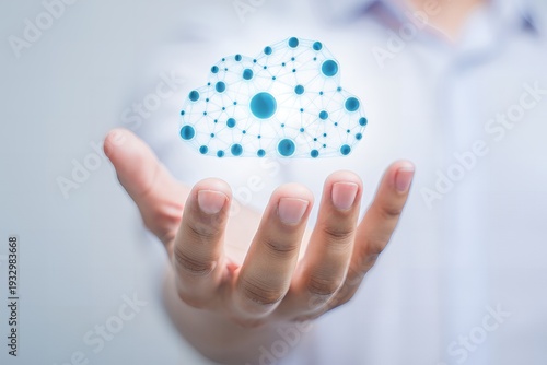 A hand with palm up and fingers spread holding a glowing blue cloud-like structure made of various sized dots floating above it