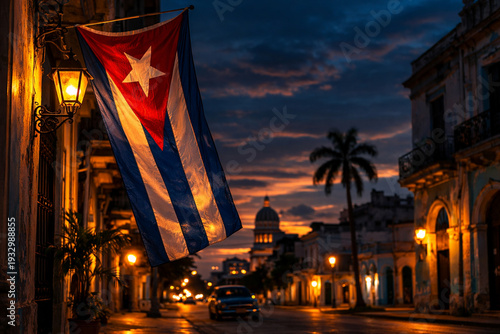 A view of Havana at night and the Cuban flag