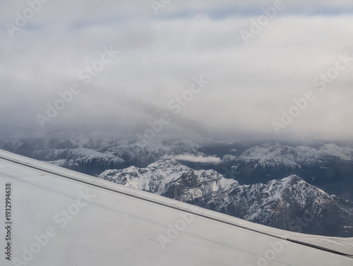 view out of the window of a Ryanair flight over the alps in europe