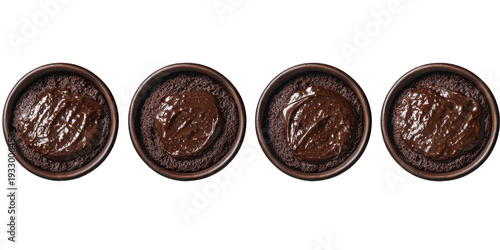 Four chocolate cakes with melted chocolate on top in round ceramic dishes side by side transparent background