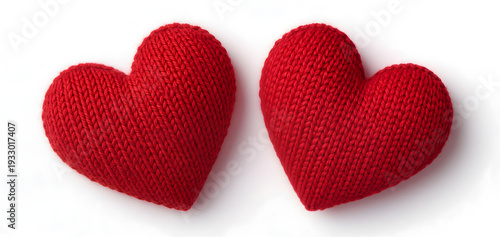 Two red knitted hearts lying on white background for valentines day wedding celebration love concept handmade craft wool texture romantic holiday