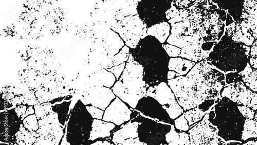 Cracked and peeling black paint texture on white surface with rough distressed pattern