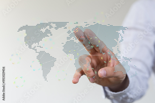 Hand touching digital world...