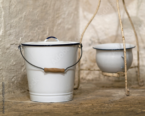 Old-fashion chamber pot and slop pail for sanitation.