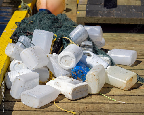 Recycled plastic bottles used as floats on fishing nets.