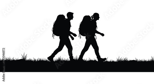 Two hikers silhouetted against a bright white background walking side by side