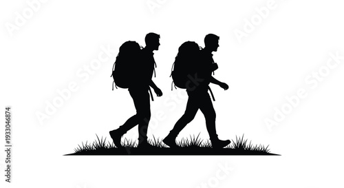 Two hikers silhouetted against a bright background walking through grassy terrain