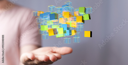 Person holding cubes repres...