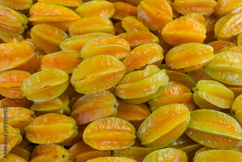 close up on fresh starfruit carambola stacking in the market
