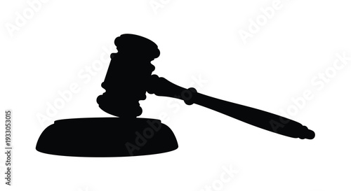 A stark black silhouette of a judge s gavel resting on a sound block symbolizing justice and legal proceedings silhouette