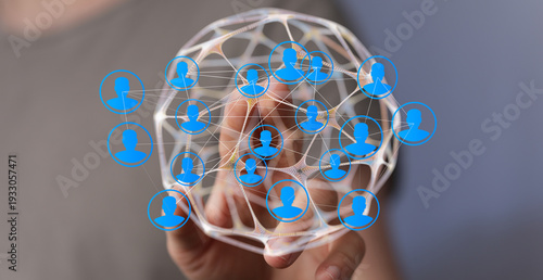 Hand holding a network of i...