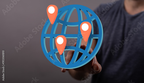 Hand touching a globe with ...