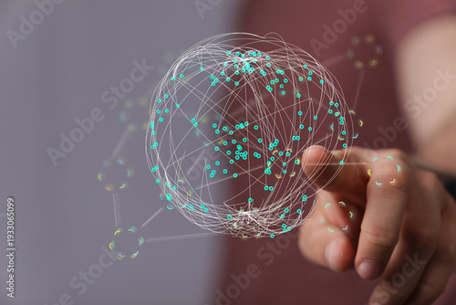 Hand touching digital globe...