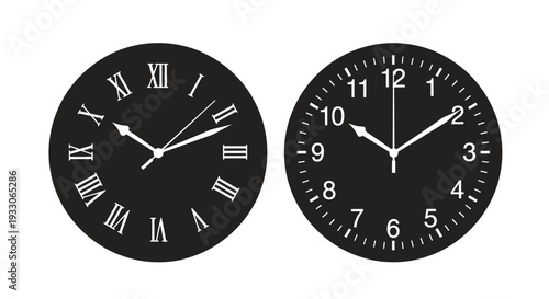 Two black clocks displaying different times stark silhouette