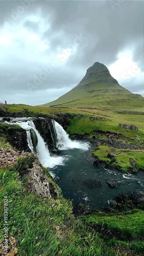 Kirkjufell Mountain and Waterfall in Dramatic Iceland Landscape