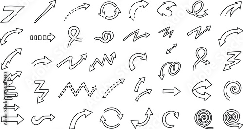 A collection of hand drawn letters and symbols in a decorative font style with arrows and flourishes